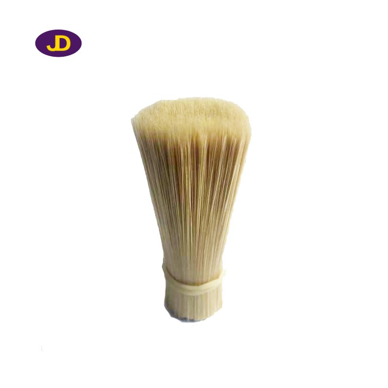 Tapered synthetic brush filament